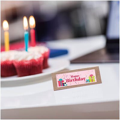 Notecard with multicolor printed label reading "Happy Birthday!" with confetti patterned background