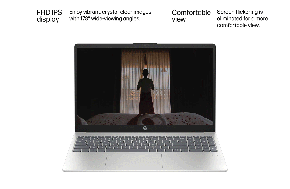 Silver 15 inch laptop shows video of a luxurious hotel