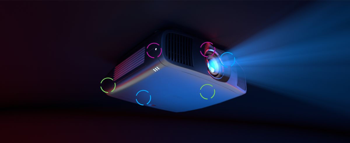 Projector hanging on the ceiling in a dark room