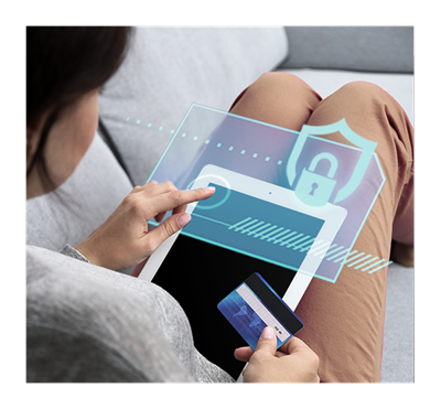 A woman keys in data of credit card on smart pad.