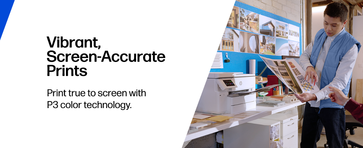 A person reviews large color prints beside an HP printer in a design workspace.