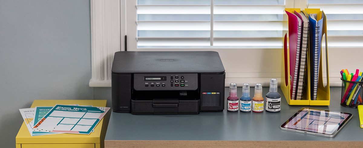 Brother DCP-T580DW on a desk in a home office environment