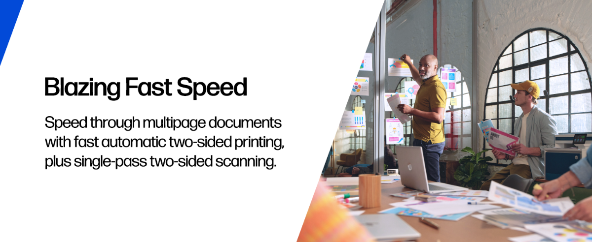 Professionals reviewing colorful prints in a modern office.