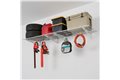 slide 8 of 10, zoom in, saferacks wall mounted garage shelving filled with storage bins, a large gas can, a cooler, 2 tires, and a lawn tools and an extension cord hanging from the accessory hooks.