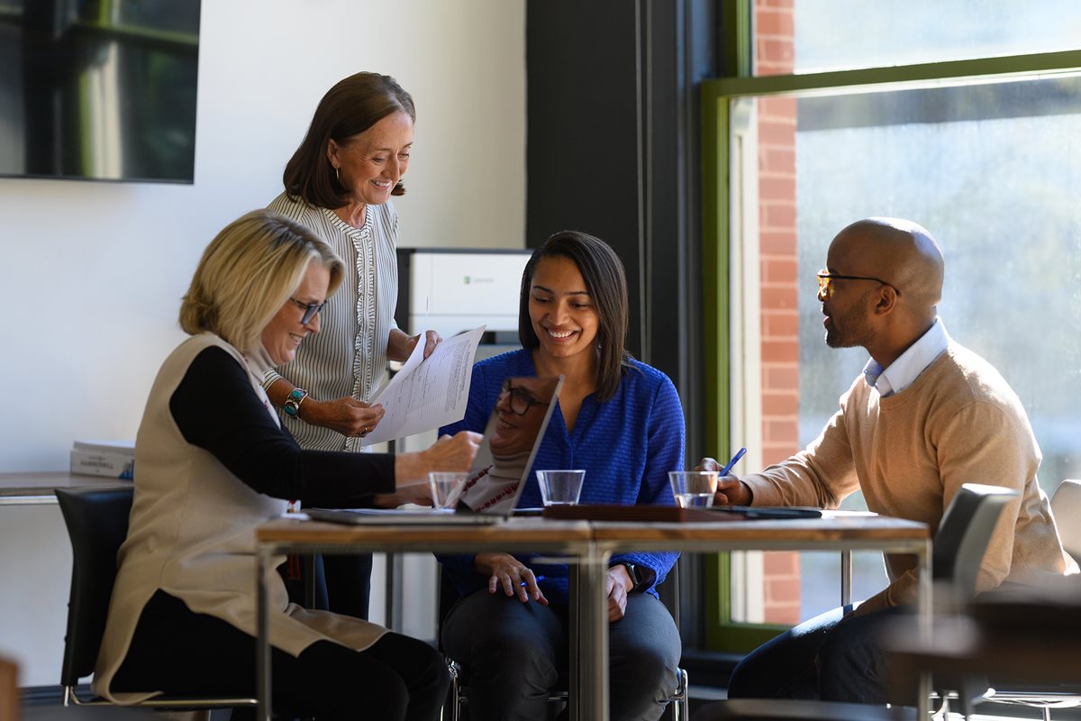 A group of people working in the meeting room