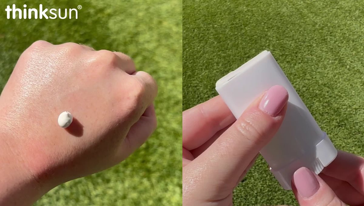 Close-up video of mineral sunscreen lotion and stick applied to skin on arm outdoors