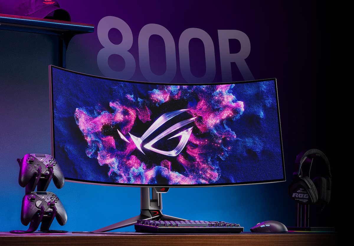 A gaming setup featuring PG39WCDM, a microphone, and keyboard