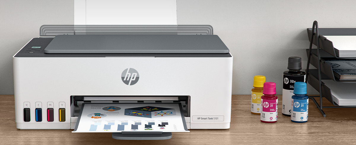 An HP Smart Tank 5101 printer outputting a colorful document with ink bottles nearby.