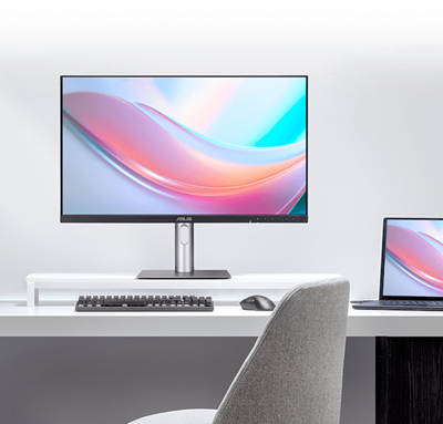 The ASUS monitor displaying vibrant colors next to a laptop screen, illustrating a consistent visual experience.