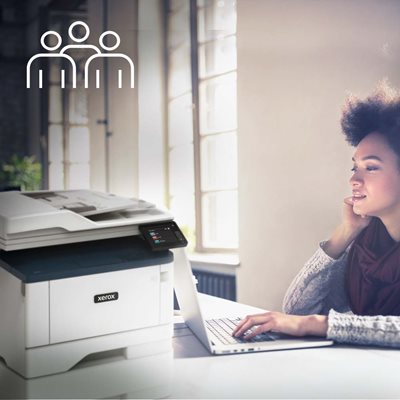 Female working in the office with laptop and Xerox B315 MFP.