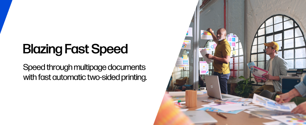 Professionals reviewing colorful prints in a modern office.