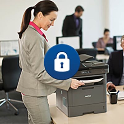 Woman at printing station, pulling printed document from the multifunction printer's output tray, with lock security icon