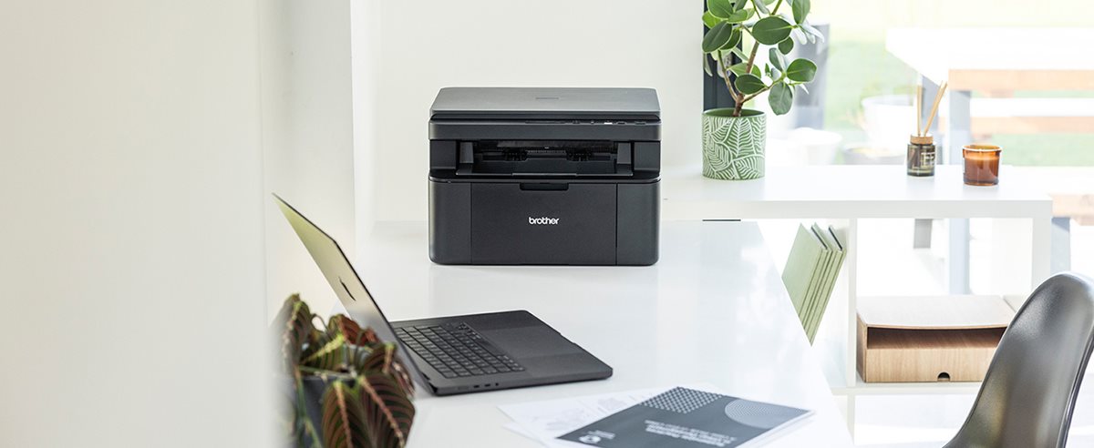 Brother DCP-L1640W on a desk in a home office environment