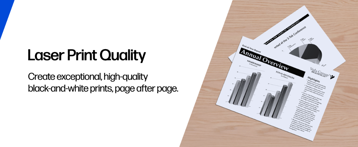 Printed reports showcasing laser print quality on a wooden desk.