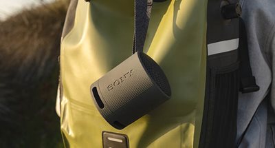 Compact speaker with versatile strap 
