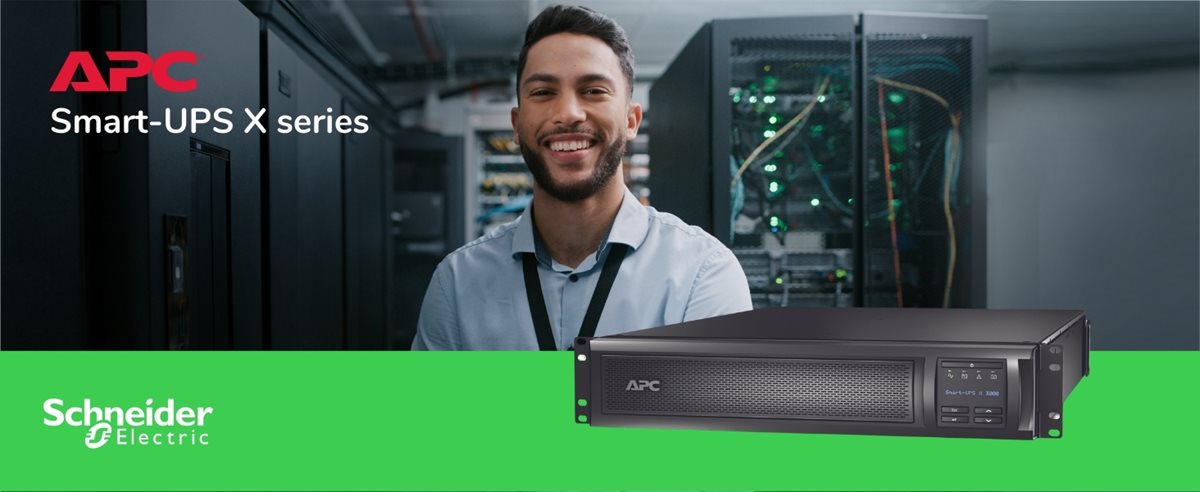 Man in an IT room with APC SMX3000RMLV2UNC