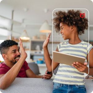 Image of daughter and father high fiving while using McAfee