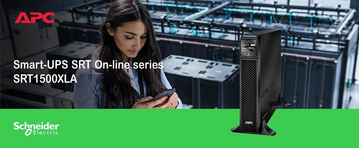 Woman in server room holding a smartphone