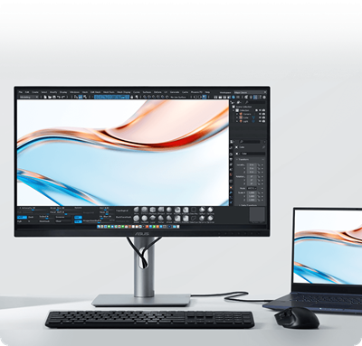 The ASUS monitor displaying vibrant colors next to a laptop screen, illustrating a consistent visual experience.