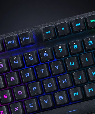 A close-up shot of the keys of the ROG Strix Scope RX TKL Wireless Deluxe, showing rainbow RGB colours shining through the keycaps