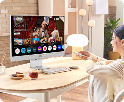 A young female professional enjoy various entertainment content on Google TV with the ASUS ZenScreen Smart Monitor MS32UC in her small living space