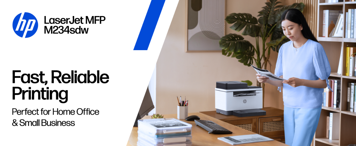 A person holding a document next to an HP LaserJet MFP M234sdw printer.