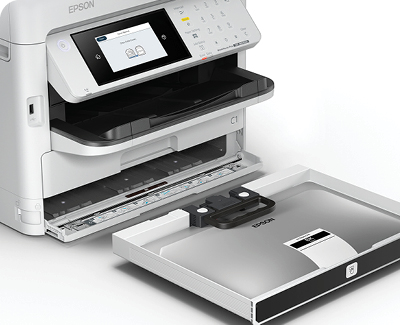 WorkForce Pro WF-M5899 Monochrome Printer sitting on desktop showing ink pack insertion.