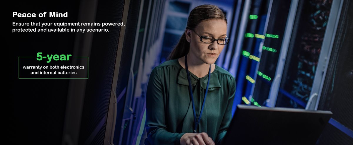 Female employee working in a data center server room
