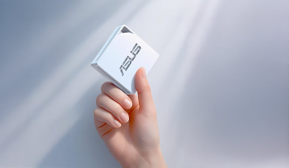 Holding the RT-AX50 Go in one hand, indicating a weight of less than 100g.