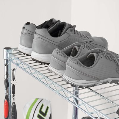 Top shelf of SafeRacks golf rack with golf shoes on top