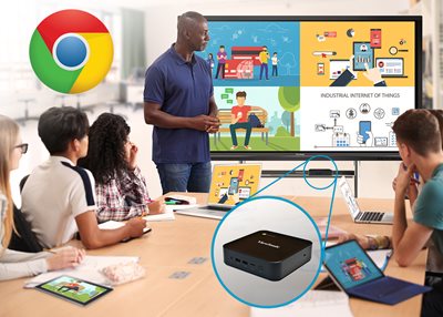 teacher in front of a class using a chromebox during instruction