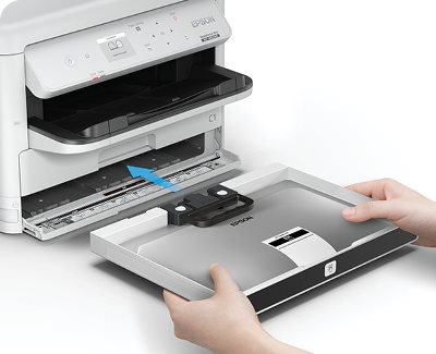 WorkForce Pro WF-M5399 Monochrome Printer sitting on desktop showing ink pack insertion.