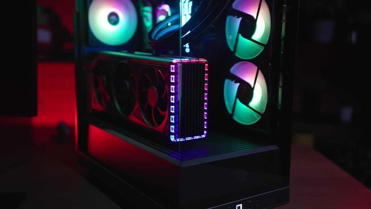 MUSIC PLAYING. iBUYPOWER HYTE Y40 PC lit up with RGB being slowly panned over on a wooden desk.