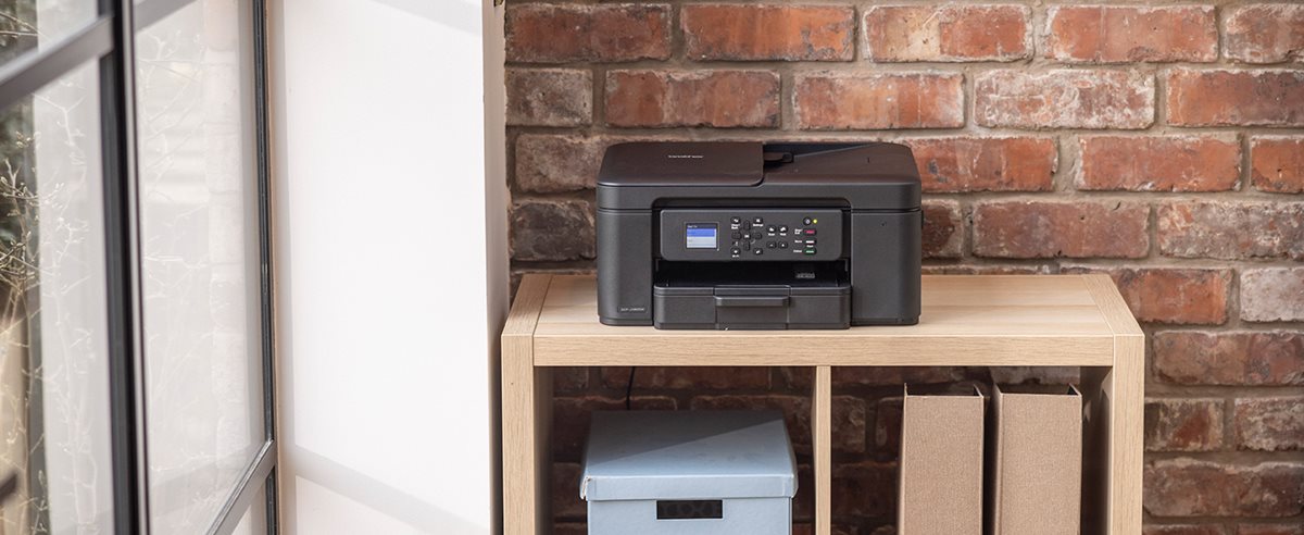 Brother DCP-J1360DW on a shelving unit in a home environment