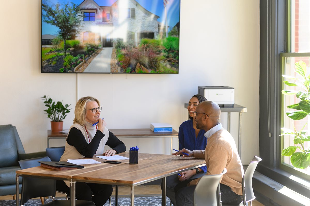 A group of people working in the meeting room