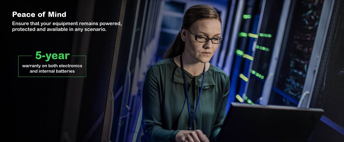 Female employee working in a data center server room