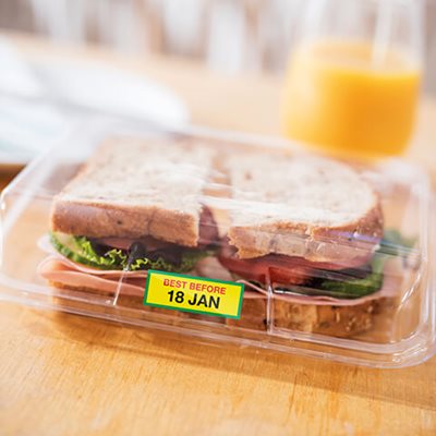 Multicolor printed label on sandwich container reading "Best Before 18 JAN"