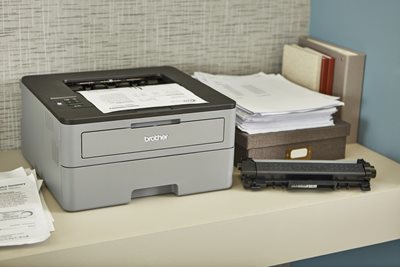 Laser printer on desk with replacement drum unit