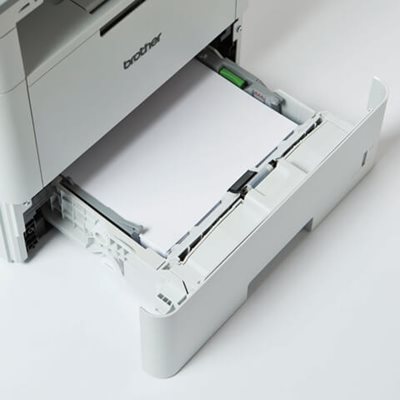 Printer on desk with paper tray open