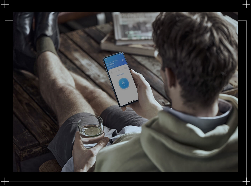 A man using Instant Guard App on zenfone 8