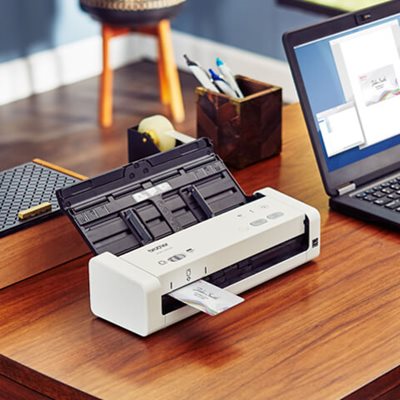 Scanner on desk, scanning a business card