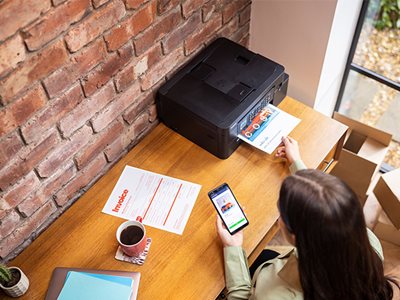 A woman printing from the Brother Mobile Connect app