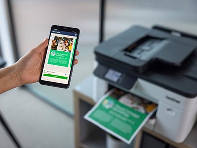 Close-up of a woman printing a colour document on a Brother MFC-J5010DW from a smartphone