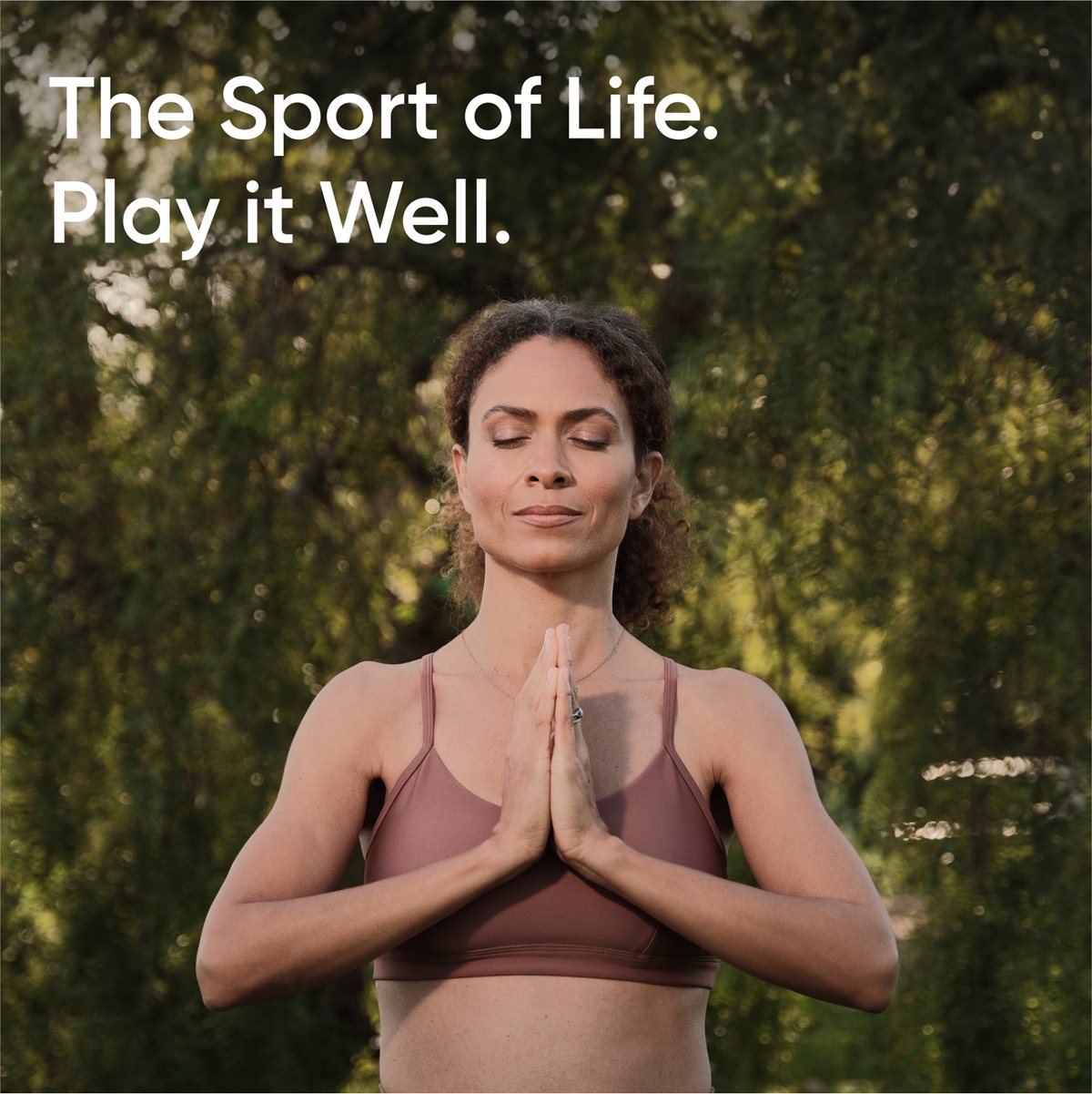 Image of a woman meditating outside. Text reads: "The Sport of Life. Play it well."