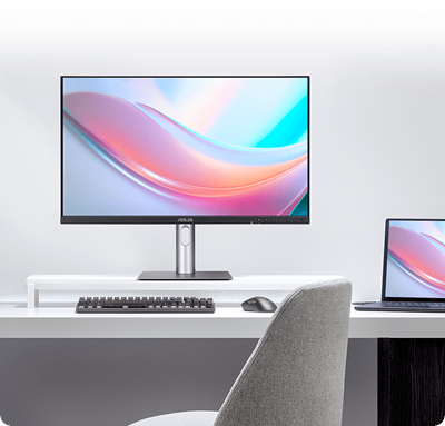 The ASUS monitor displaying vibrant colors next to a laptop screen, illustrating a consistent visual experience.