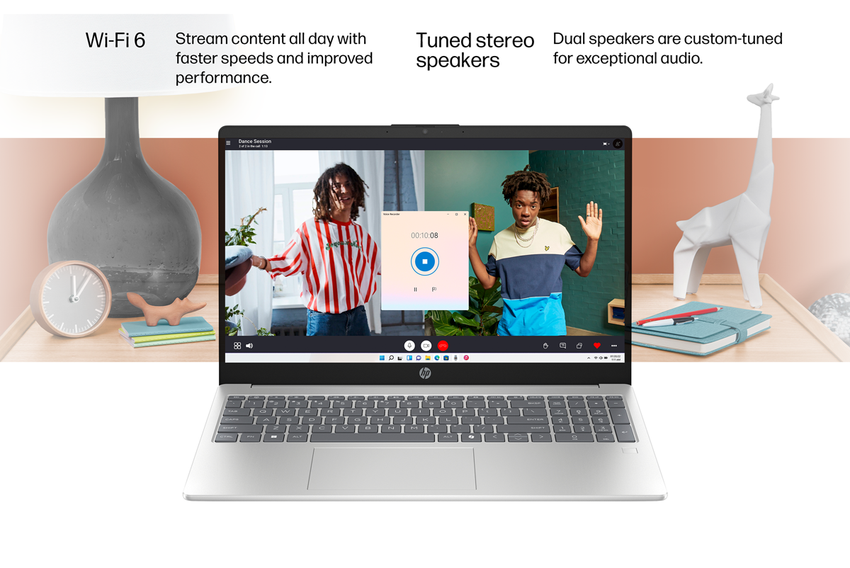 Silver HP laptop PC shows music player
