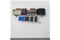 slide 1 of 10, zoom in, saferacks wall mounted garage shelving filled with storage bins, large tools, a cooler, 2 tires, and a ladder hanging from the accessory hooks.