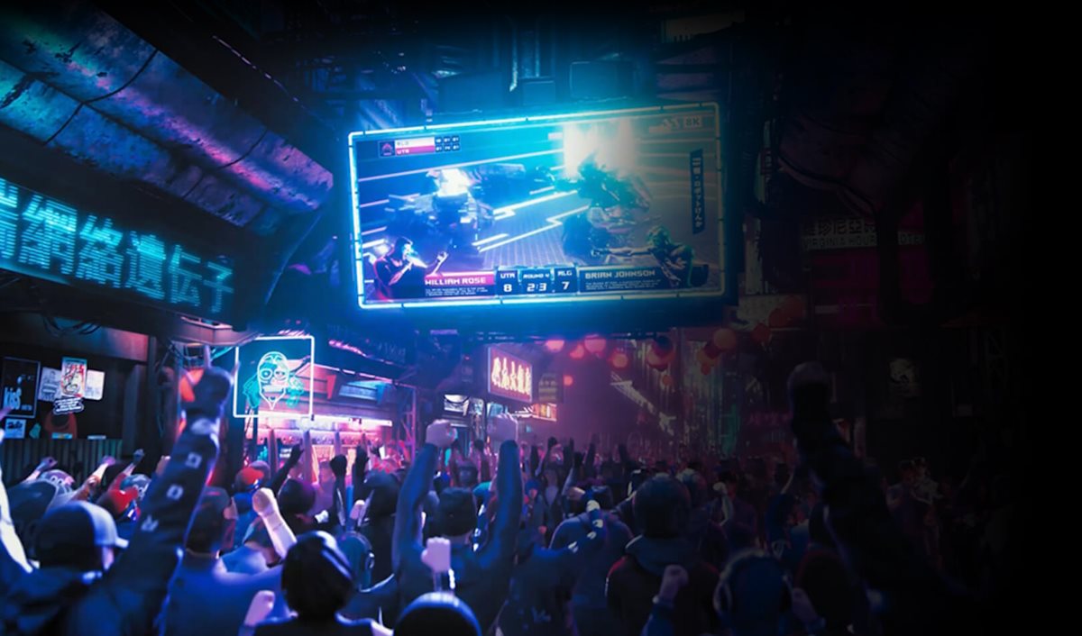 A crowd watching a live broadcast of a battle
