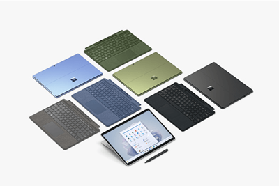 Layout of colorful devices and Surface Pro Signature Keyboard in geometric pattern