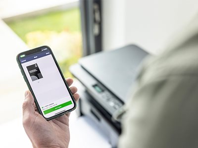 A man printing from the Brother Mobile Connect app